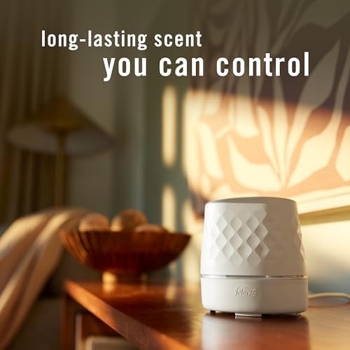 Febreze PLUG Scent Booster Starter Kit, Oil Diffuser, Air Freshener Plug In, Continuous Scent Device + 2 Downy Calm Refills - Image 2