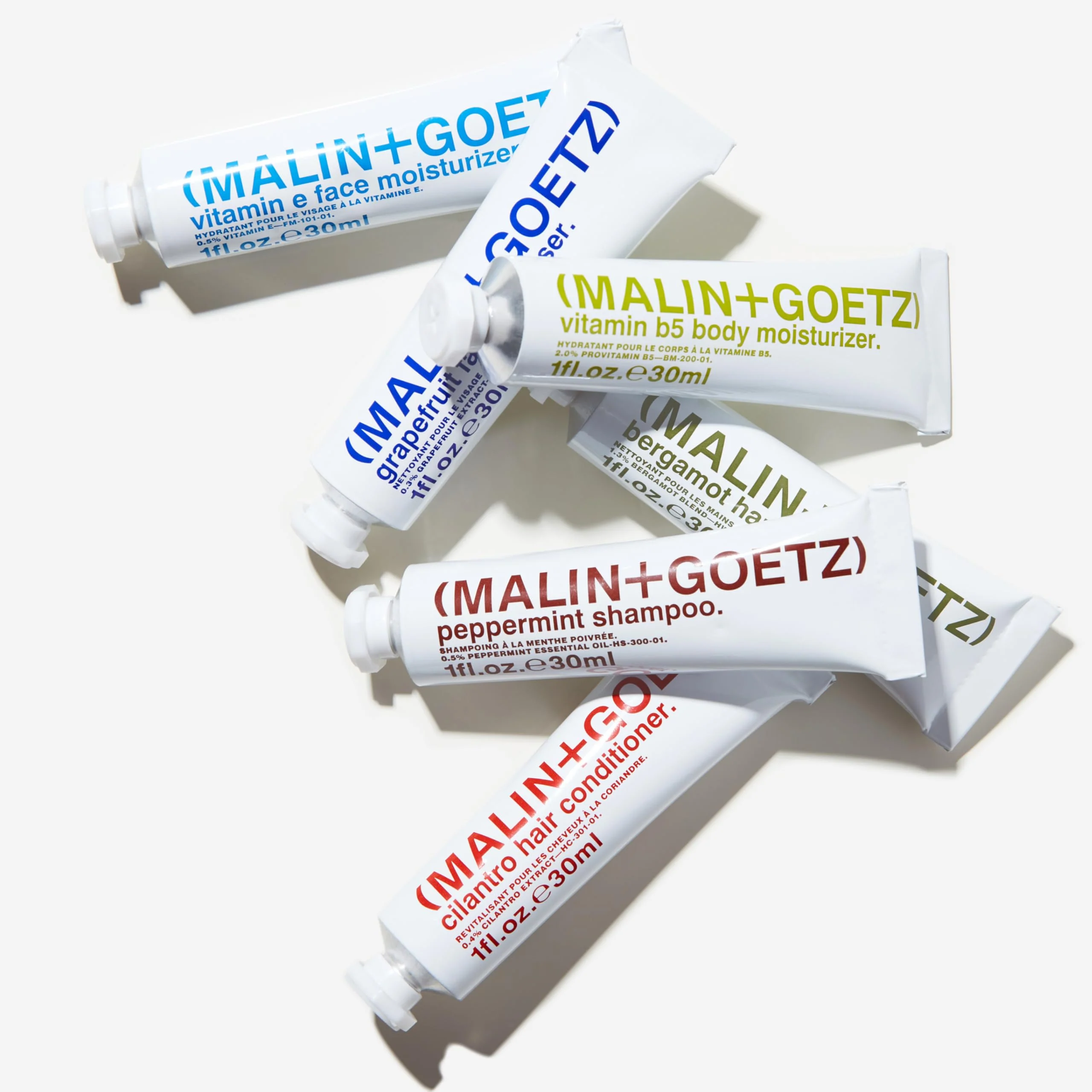 MALIN+GOETZ Best-Sellers Travel Kit | Six Everyday Essentials for Face, Body + Hair | Grapefruit Face Cleanser, Vitamin E Face Moisturizer, Peppermint Shampoo + More | Vegan, Travel-Friendly(6 x 1 oz) - Image 7